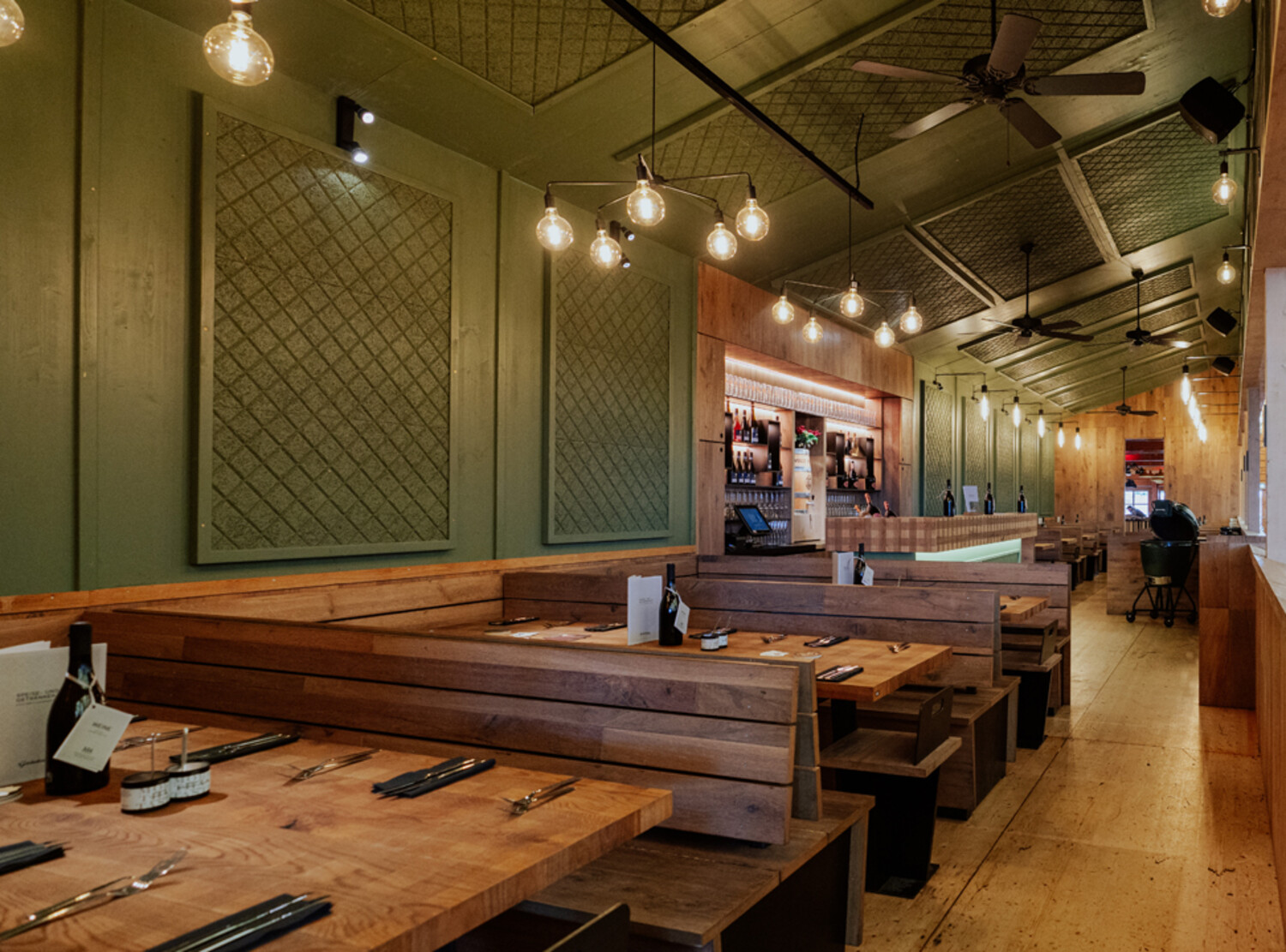Interior design with wood and green colours of the festival tent